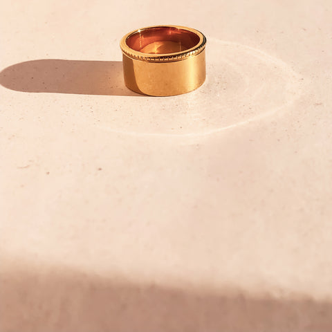 Ring laying flat on tile in the sun