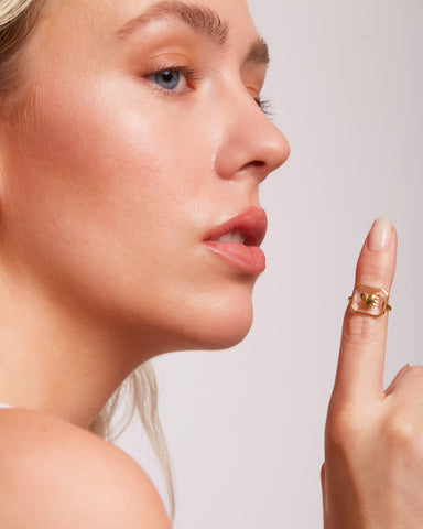 Model with ring extended on finger