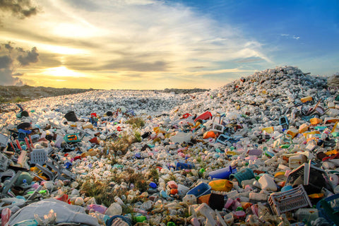 A pile of plastic garbage against a blue sky