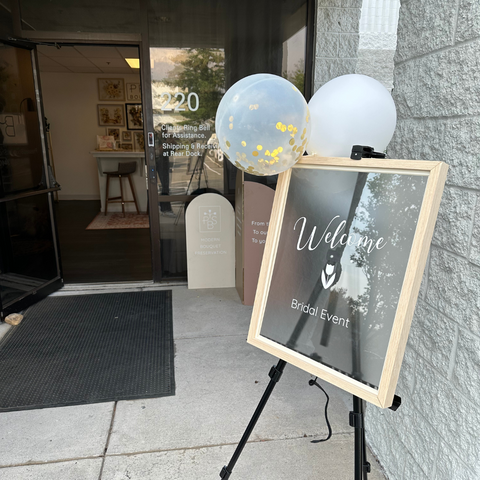 Element, previously Pressed Bouquet Shop's front entrance into a bridal event showcasing signage and balloons.