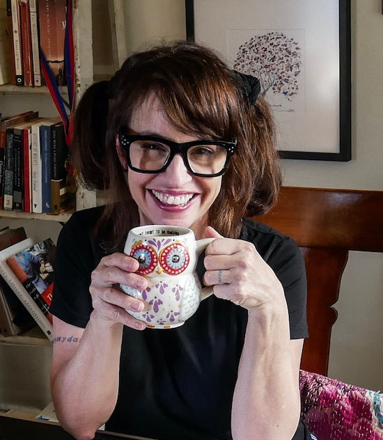 Tracy Mazuer holding coffee mug