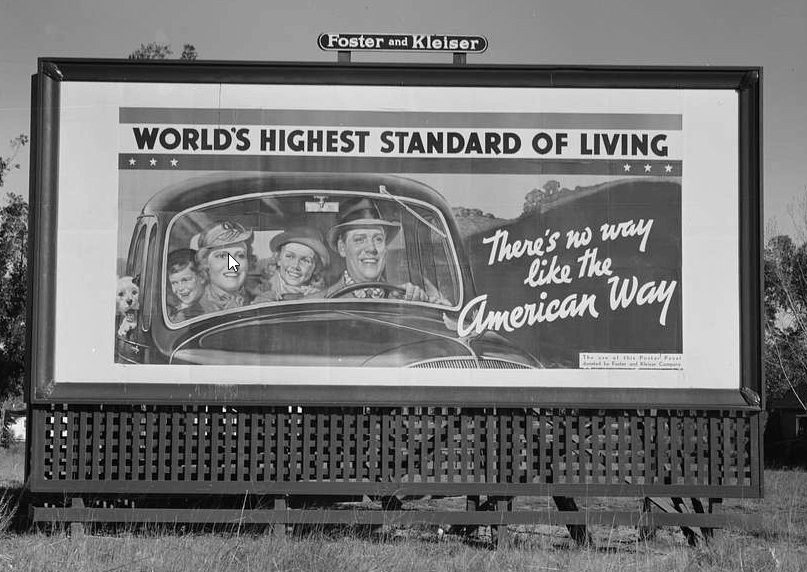 billboard sign on US highway 99 about world's highest standard of living