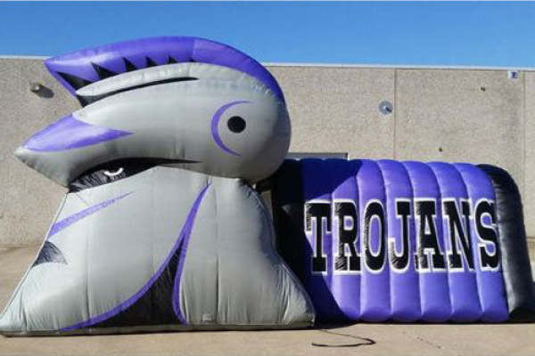 purple football inflatable for the trojans team