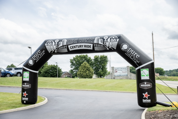 Amish County Century Ride archway with four sponsors’ logos on both sides