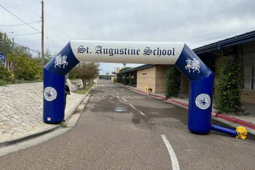 blue and white inflatable arch at school entrance