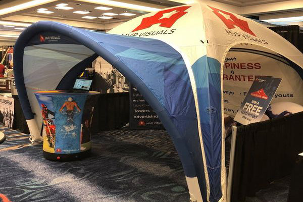 custom inflatable dome tent at indoor trade show booth