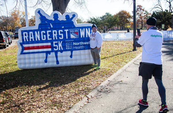 people taking photo at Rangers 5K custom inflatable