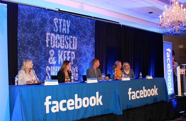 people at table branded with Facebook Custom Table Cloths