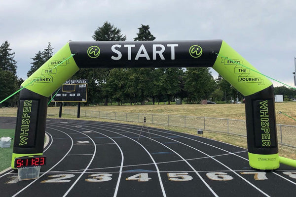 branded inflatable arch on a track field