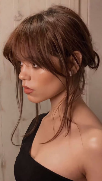 Birkin bangs with an updo hairstyle