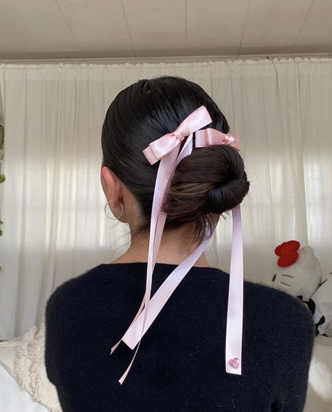 Bow on Messy Low Bun Hairstyle