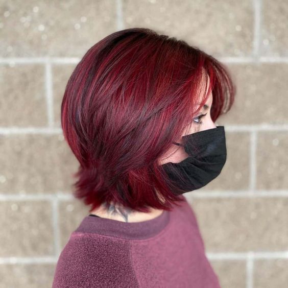 wolf cut burgundy highlights