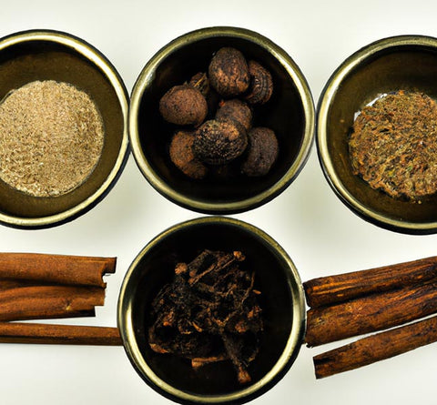 flavor extracts allspice clove cinnamon nutmeg arranged on table - Culinary Solvent