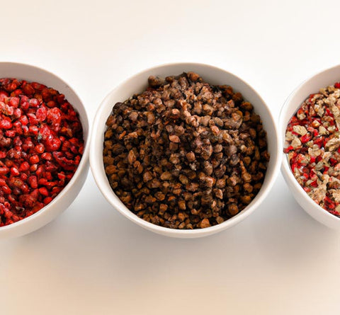 flavor extracts black peppercorn pink peppercorn red pepper flakes in bowls - Culinary Solvent
