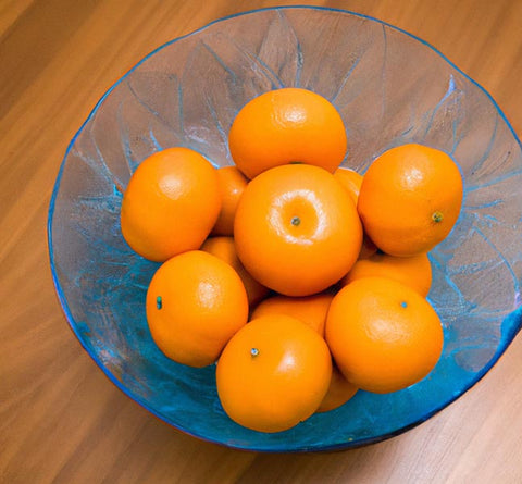citrus extracts mandarin oranges in blue bowl - Culinary Solvent