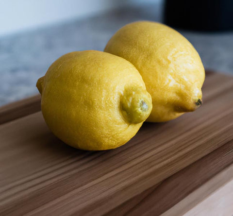 citrus extracts meyer lemons on cutting board - Culinary Solvent