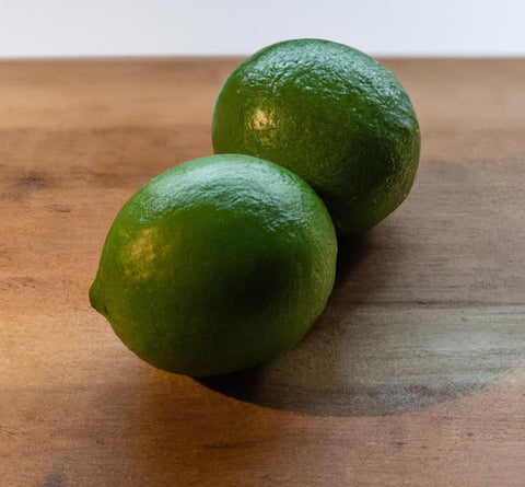 citrus extracts key limes on cutting board - Culinary Solvent