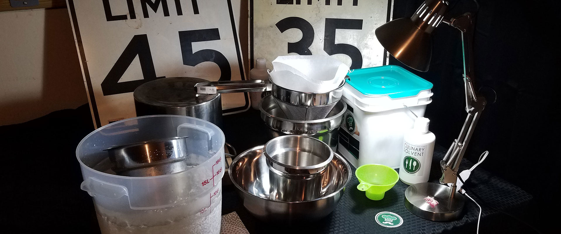 alcohol tincture making tools displayed on a workbench