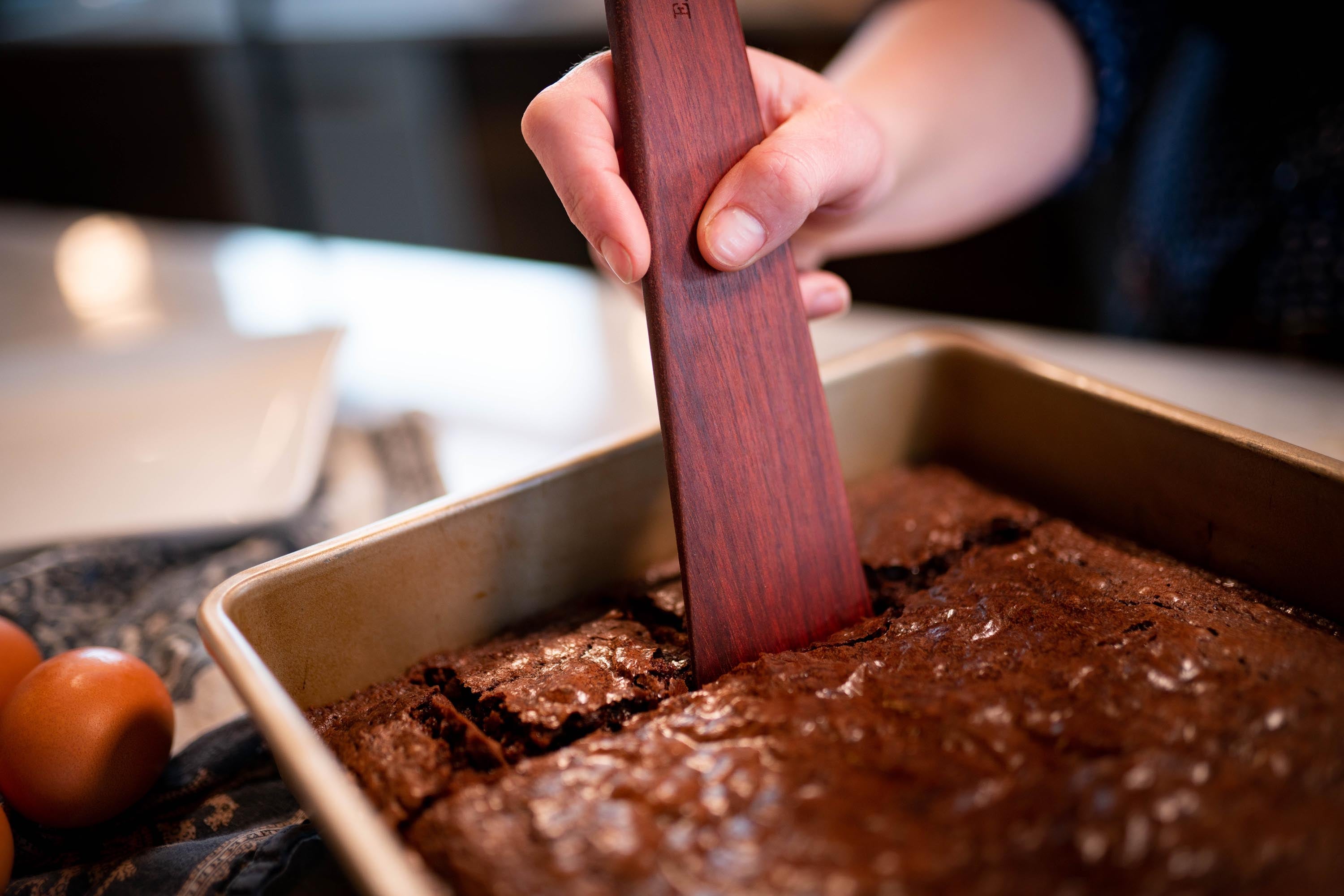 Using the wooden Tera Scraper to serve brownies