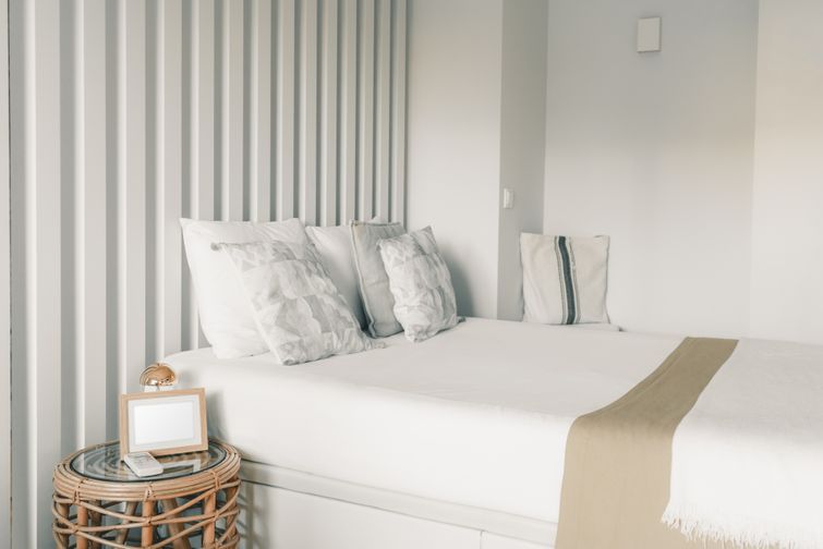 Neatly made bed with wrinkle resistant bamboo sheets