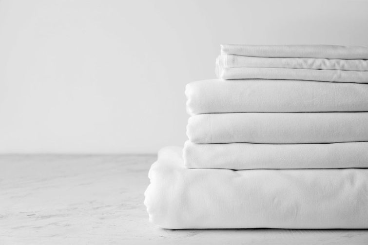 A stack of freshly-washed bamboo bed sheets