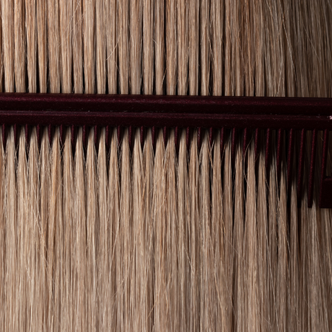 Regular combing helps keep wigs and toppers free from tangles
