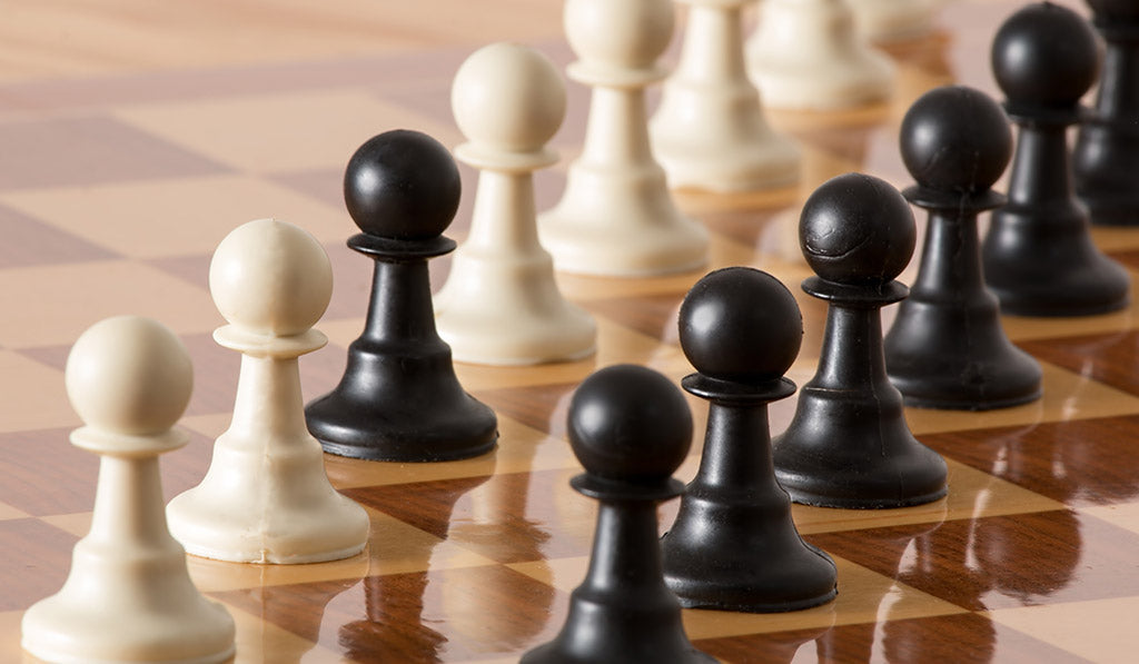 Open chess board with chess pieces isolated on white Stock Photo