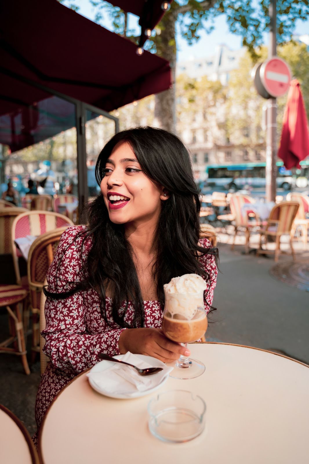 Girl drinking a coffee in Paris