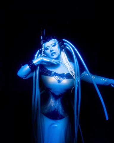 Christina Aguilera in a custom Vex latex costume as Diva Plavalaguna from the Fifth Element for Halloween.