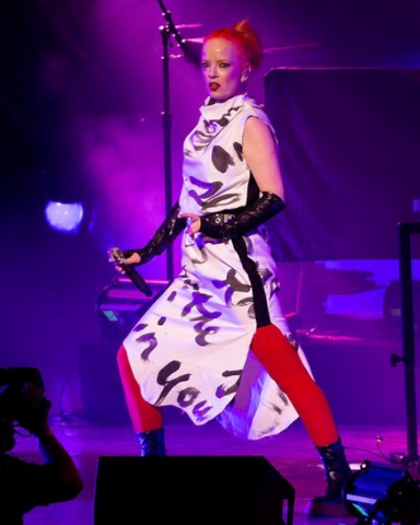 Garbage wearing Vex Opera Knuckle Gloves on tour.