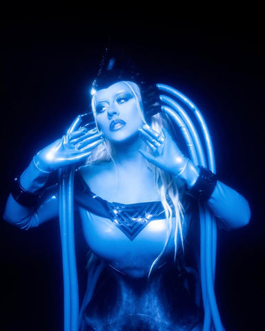 Christina Aguilera in a custom Vex latex costume as Diva Plavalaguna from the Fifth Element for Halloween.