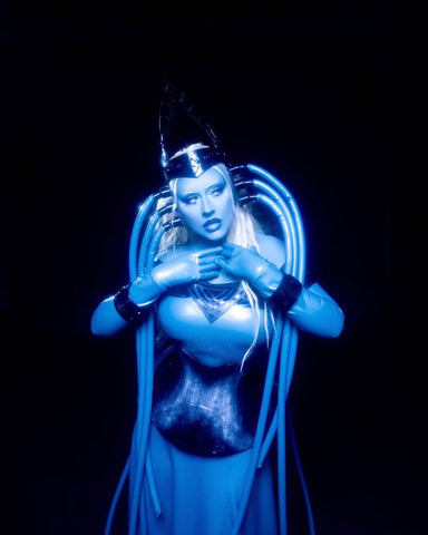 Christina Aguilera in a custom Vex latex costume as Diva Plavalaguna from the Fifth Element for Halloween.