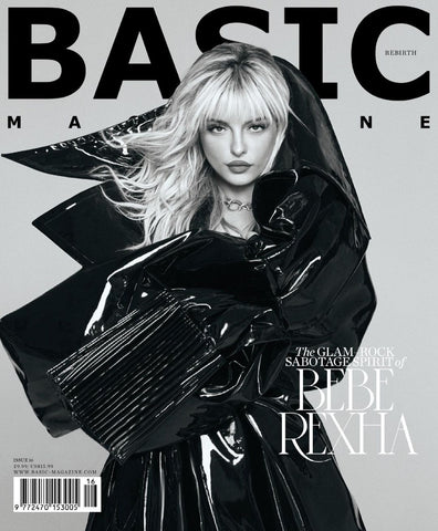Bebe Rexha wearing oversized black latex outfit on the cover of Basic Magazine looking right into the camera