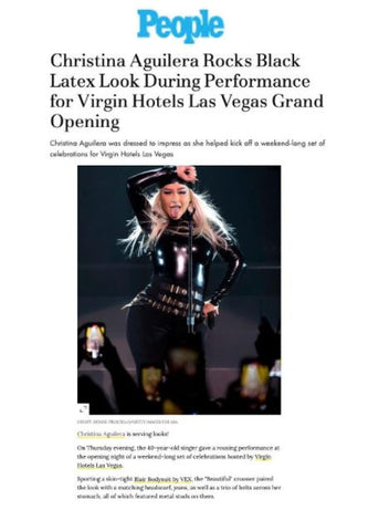 Christina Aguilera featured in People Magazine wearing black Vex latex bodysuit and bandana performing on stage 