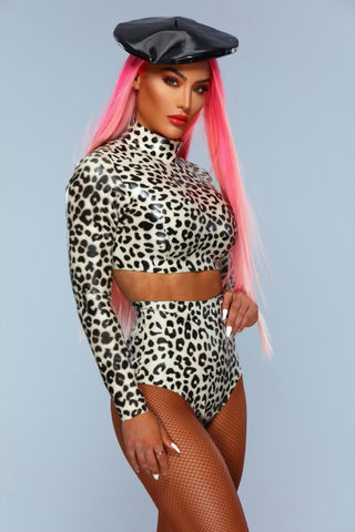 Woman wearing Vex's leopard print long sleeve crop top, matching knicker with black boots, beret and long pink hair