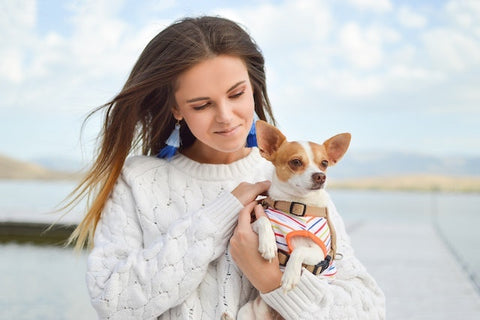 A woman holding her puppy