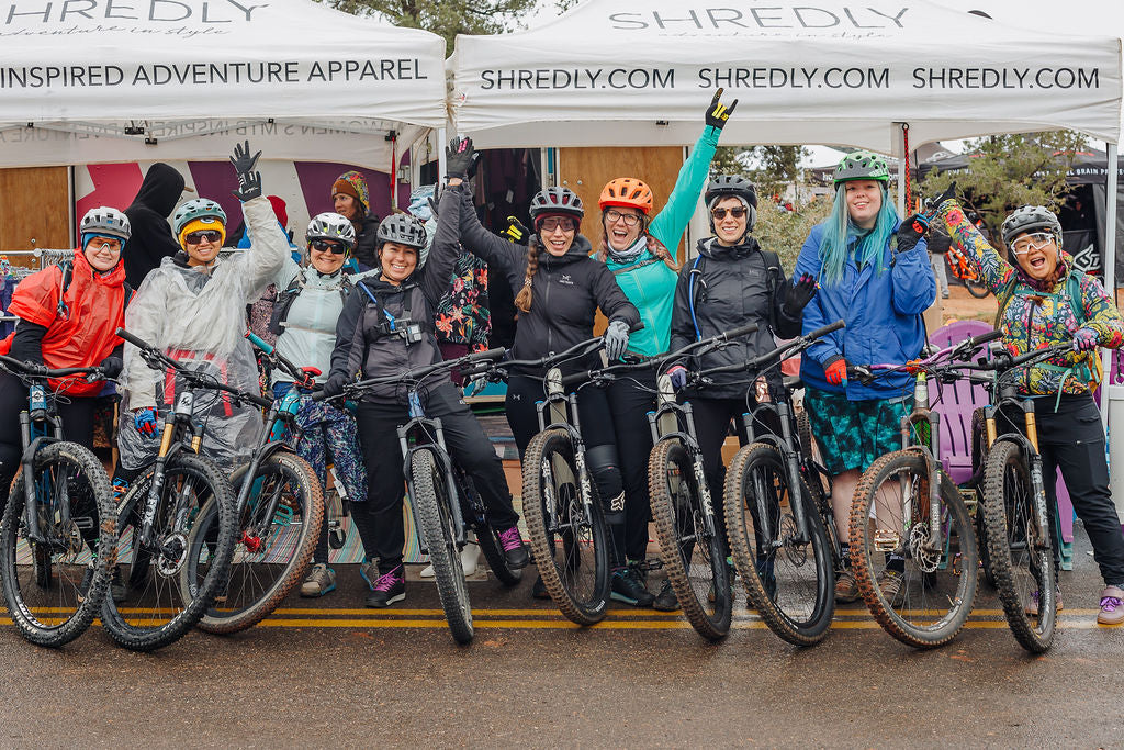 A group of women mountain bikers excited for a group ride.