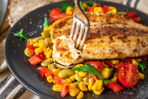 Pan Seared Trout and Summer succotash with fork