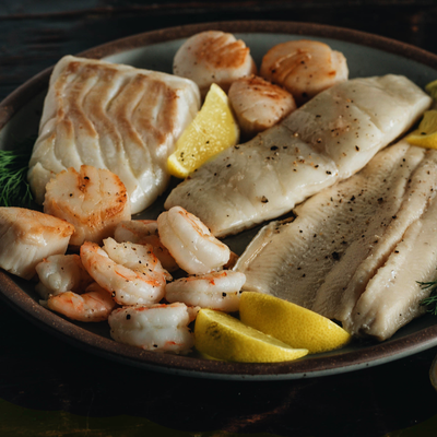 https://cdn.shopify.com/s/files/1/0250/8353/products/Wild-Gulf-Shrimp-Sea-Scallops-Rainbow-Trout-and-Atlantic-Haddock_400x.png?v=1571420571