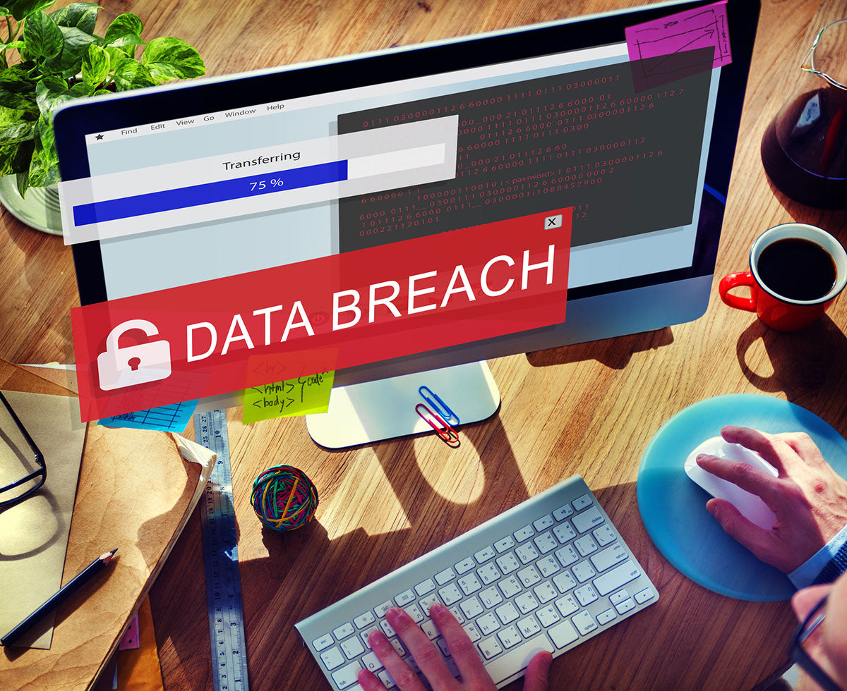 Computer with a data breach alert pop-up