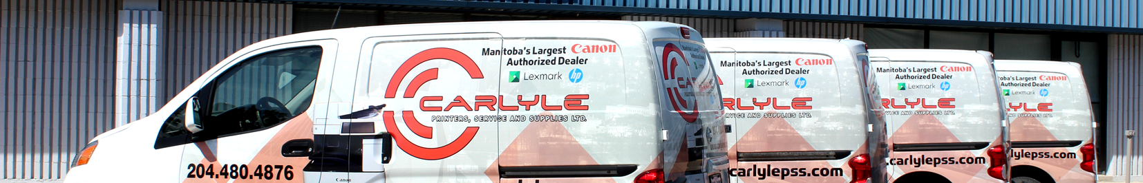 Four Carlyle branded service cube vans