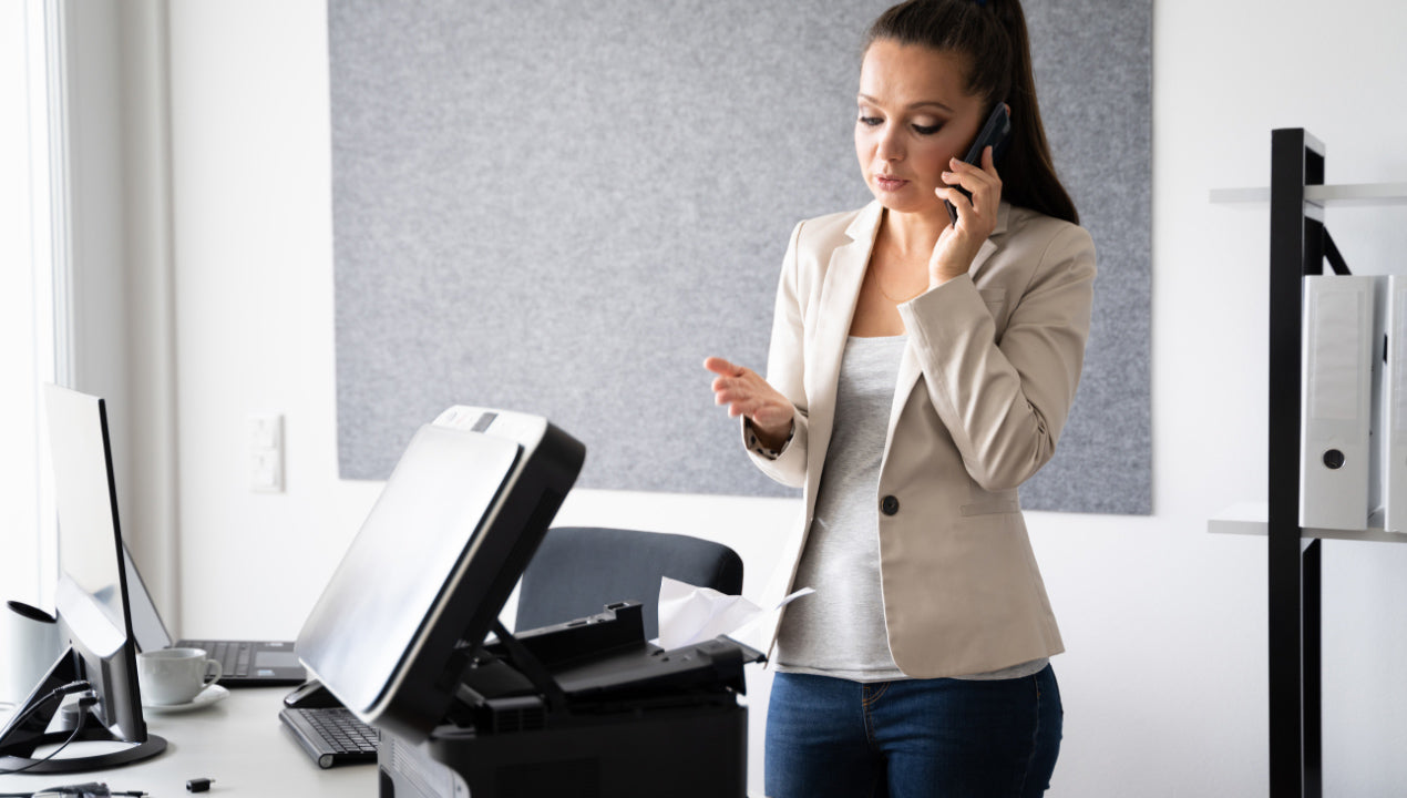 Office workers experiencing paper jams