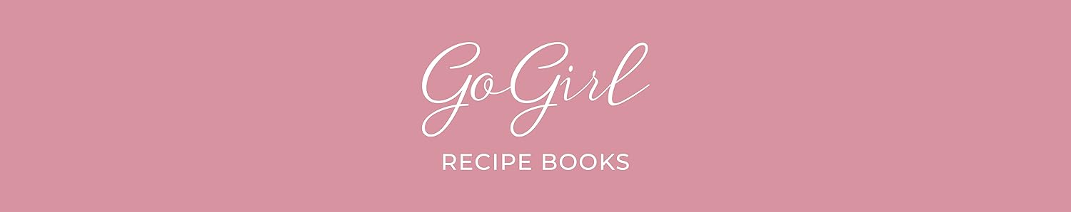 A collection of stylish recipe books including a pink hardcover notebook with foil lettering, a blue book with gold corners & floral stickers, and a green book with stripes and bows.