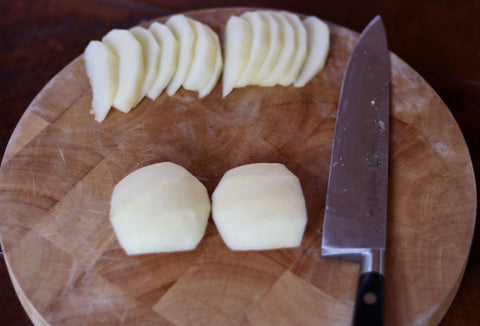 Two apple quarters thinly sliced.