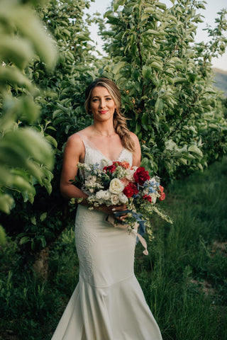 The Venue at Chelan Ranch bride in orchard