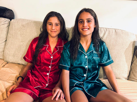 sisters in red and green christmas pjs