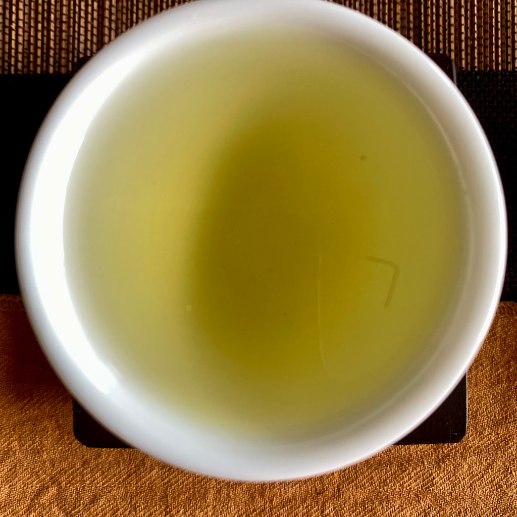 Shan Lin Xi High Mountain Oolong brewed tea in a cup