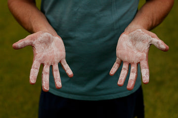 Man shows hands with dried liquid Cheer Chalk