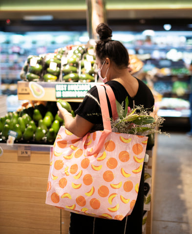 Grocery shopping with large Hello Weekend Peachy Weekender Bag available at WYLD Shop