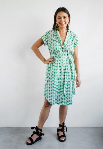 Model wearing Nala Designs green shirt dress with mandarin collar and jacaranda flower print, available at The WYLD Shop